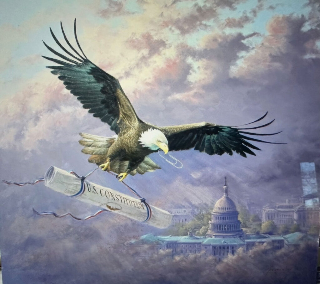 Eagle with paperclip and rolled up constitution